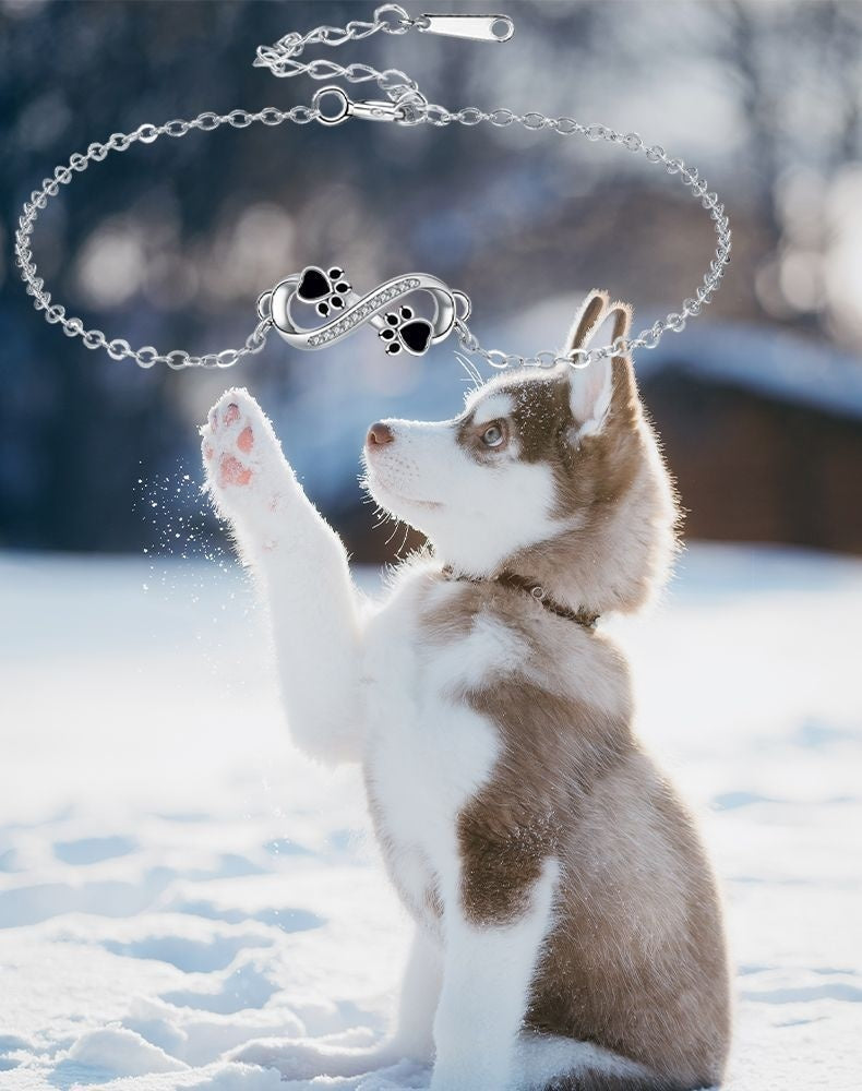 Bracelet avec symbole de l'infini, charms avec empreinte de patte et zircons