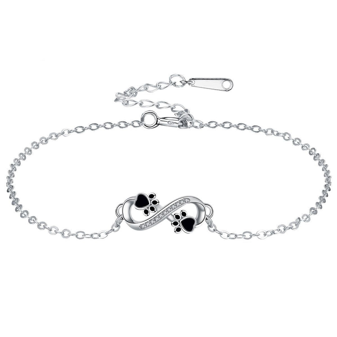 Bracelet avec symbole de l'infini, charms avec empreinte de patte et zircons