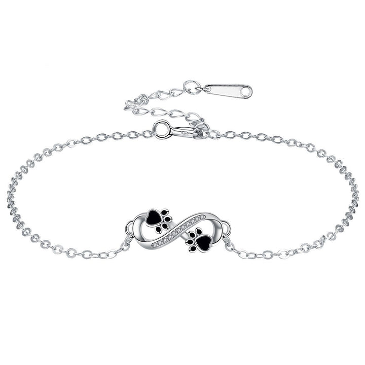Bracelet avec symbole de l'infini, charms avec empreinte de patte et zircons