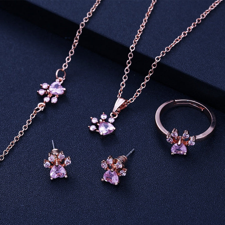Ensemble de bijoux avec pattes pour femmes – 4 pièces | Or rose avec cœur en zirconia – Bague, collier, boucles d'oreilles et bracelet